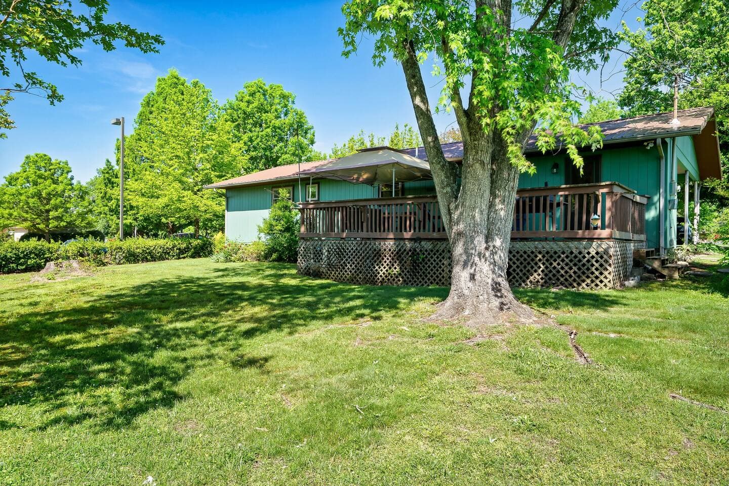 The covered deck with Adirondack rocking chairs