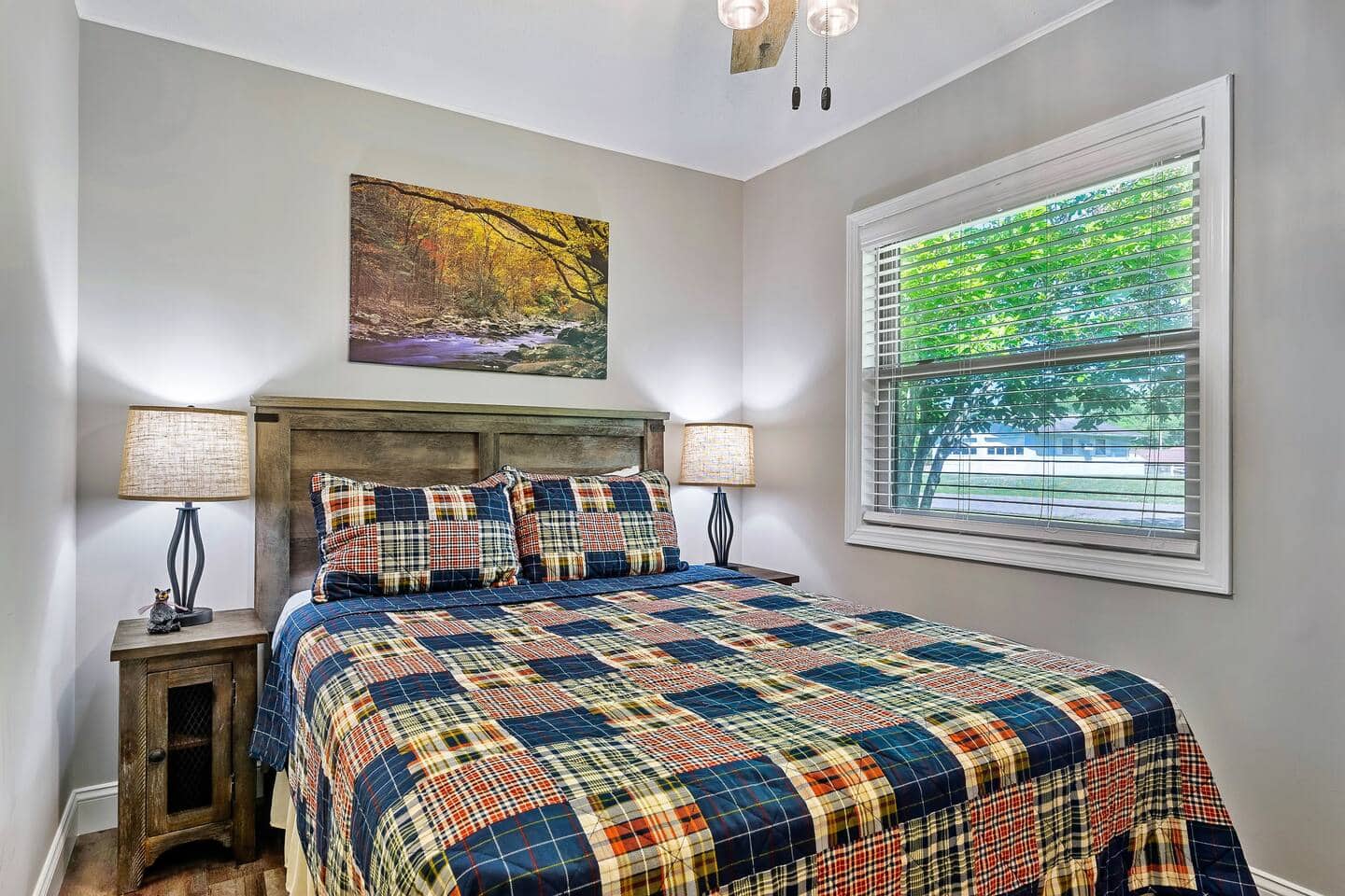 Third bedroom with queen bed and natural light