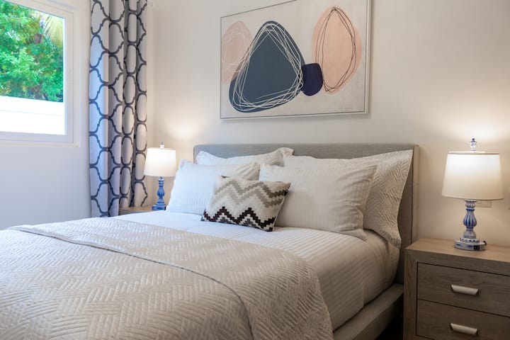 This is a second bedroom with a queen size bed