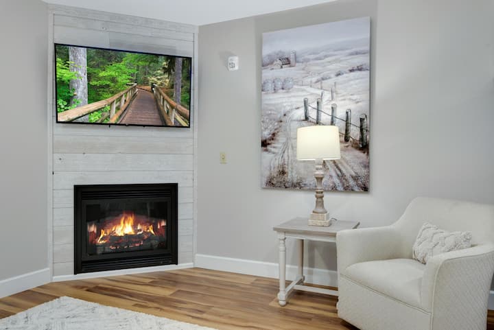 Our Living Room features a 55" 4k Smart TV and a beautiful gas fireplace for your enjoyment.