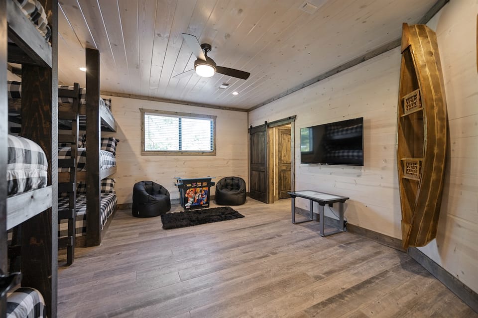Bunk room with arcade games