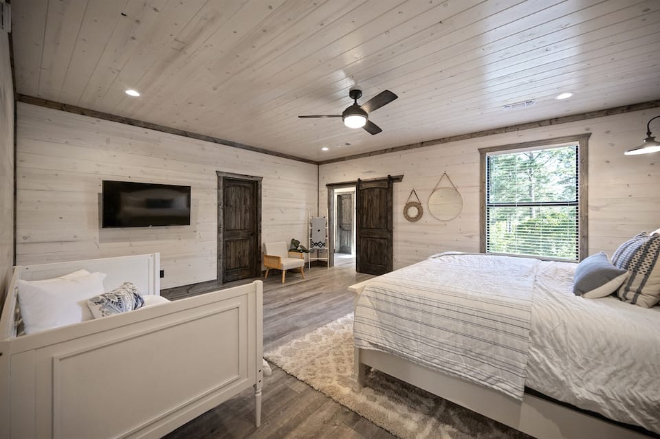 Master suite with king bed and woodland views