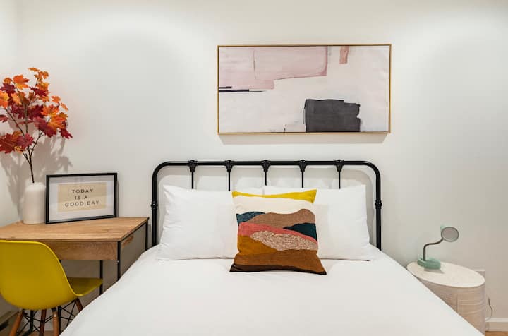 Queen bed with two twin daybed, and desk located on the main level