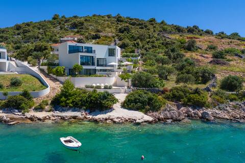Luxury seafront villa roots with heated pool