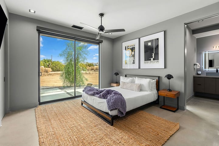 King bed, ensuite bathroom with waterfall shower, smart TV, floor-to-ceiling sliding doors
