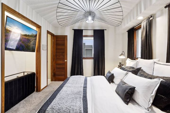 King-size comfort in Bedroom #1 on the main level, a blend of modern elegance and restful nights.