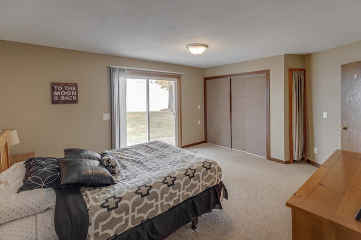 the second master suite is situated at the opposite end of the home, offering sliding doors that open to the patio with a stunning lakeside view. Additionally, it features an exceptional private bathroom.