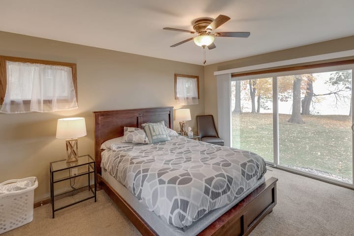 Our first master suite offers a private bath, seclusion at the home's far end for added privacy and tranquility, and sliding doors that open to the lakeside.