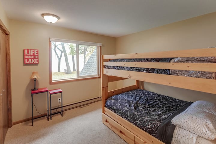 the third bedroom features a twin-over-full trundle bed, accompanied by an additional twin bed, ideal for accommodating overflow guests.