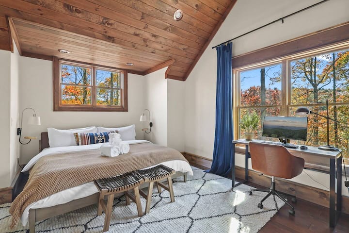 This luxurious king suite is located to the left of your children's bunk area. You'll love looking out at all those trees while you're staying here!