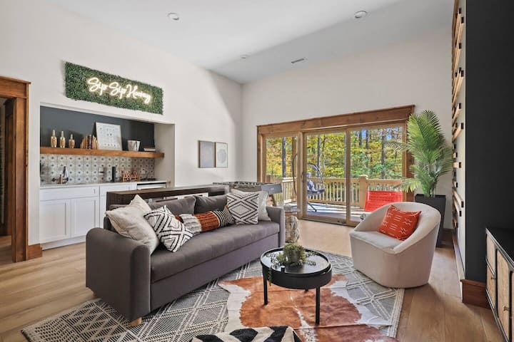 Don't miss the wet bar with sink, bartender kit, and a mini fridge. 