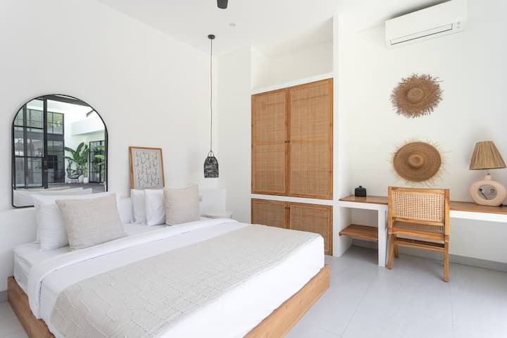 Guest bedroom #2 with a closet and a working area