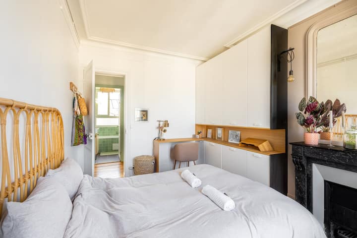 BedRoom with a little desk & a period fireplace