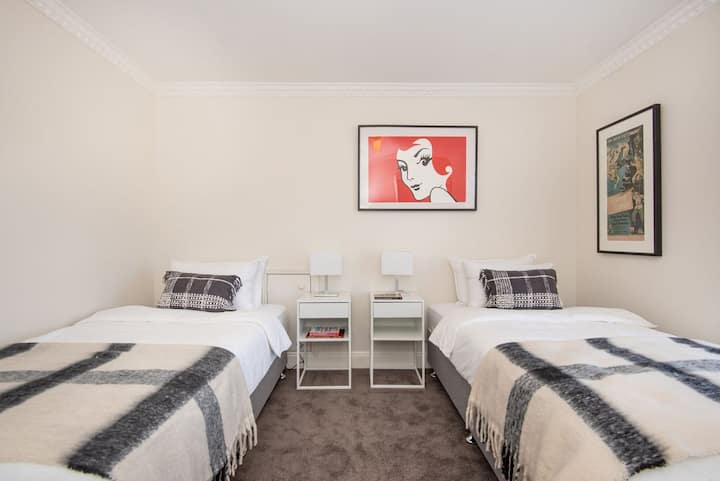 Bedroom four upstairs with two king single beds 