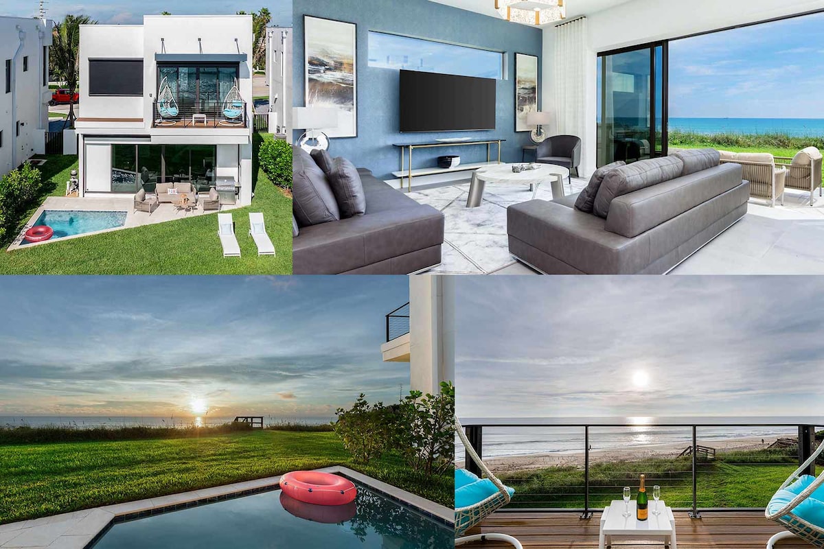 The image showcases a modern beach villa with a private pool. The open-concept living space features large leather couches and an entertainment unit. Floor-to-ceiling glass doors provide expansive ocean views and direct access to the patio, while a spacious balcony overlooks the shoreline at sunset.