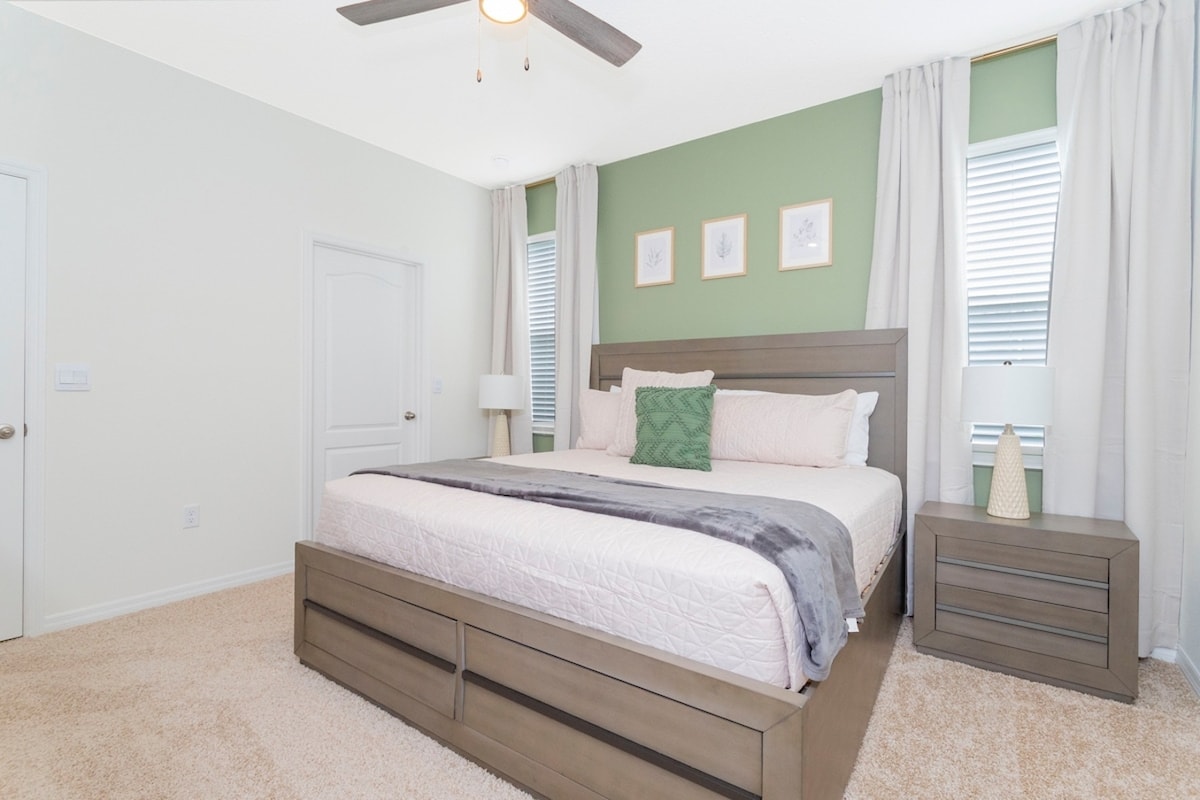 A big bedroom for two, featuring sumptuously comfortable king sized  bed that redefine the meaning of a good night's sleep. Plus a Tv and great Pro decoration.