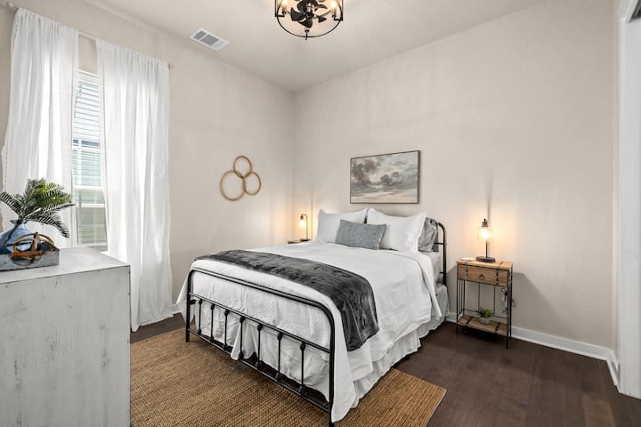 Queen Bedroom just off secondary bedroom and across the hall from the bunk room. 