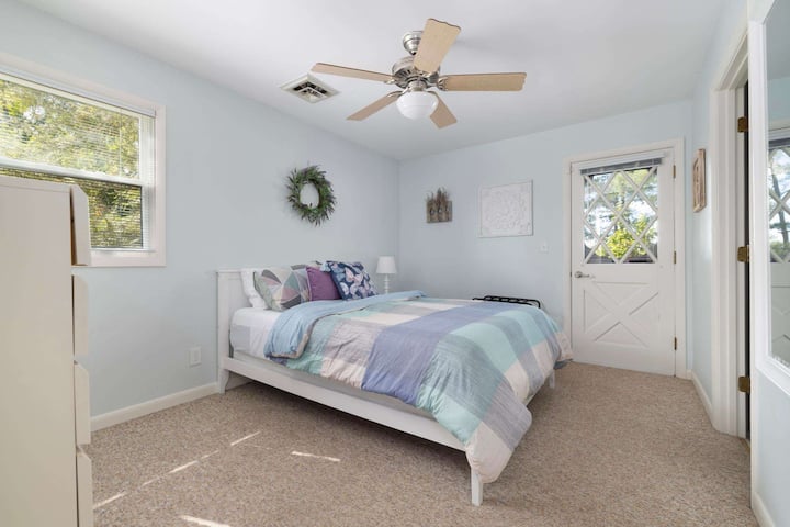This cozy second upstairs bedroom offers a quiet space to relax, unwind, and enjoy a peaceful night’s sleep.
