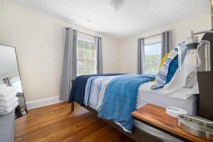 Bright and comfortable, this queen bedroom is perfect for unwinding after a day of exploring.