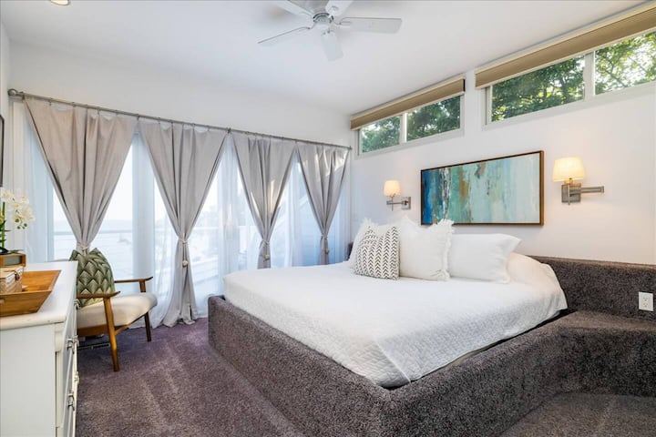 The Primary Bedroom boasts a King bed with water views, and a private deck overlooking the beach