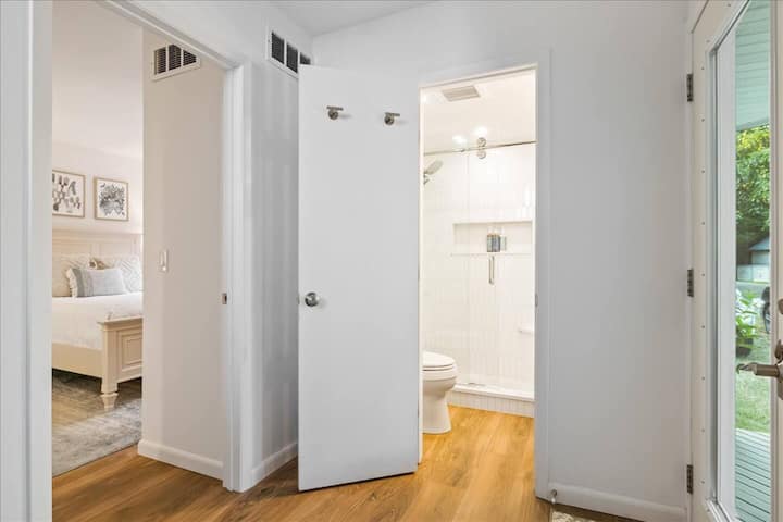 Stepping in through the entry door, there is a shared bathroom and one Queen bedroom with an ensuite bathroom
