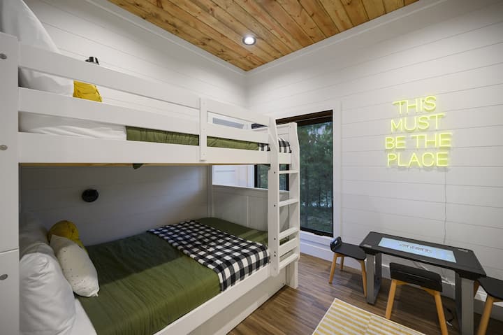 Bunk room with full-size beds and a pull-out trundle. Perfect for kids or a group that needs every bed.