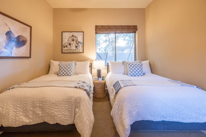 A bedroom with two Full beds.