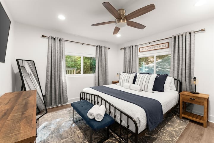 Master with King size bed, flat-screen TV, and en-suite bathroom.