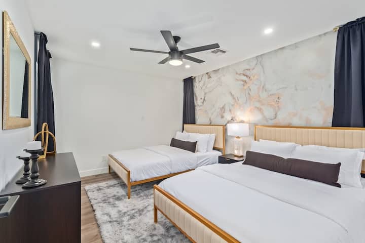 The first bedroom on the main floor was created to mimic your typical Vegas hotel room. This room features two queen beds to accommodate up to 4 guests.