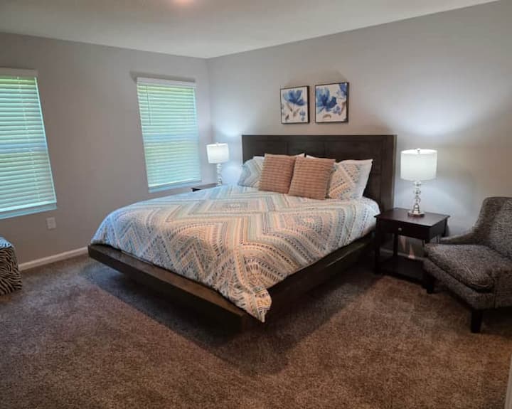 Comfortable bedroom featuring a cozy king bed.