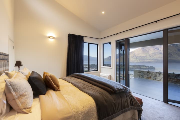 Master bedroom with lake views and balcony