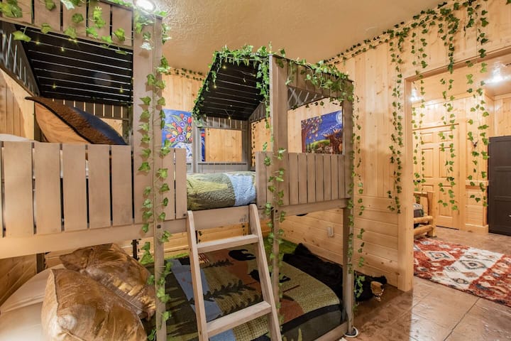 The first basement bunk room features a bunkbed with two full mattresses.
