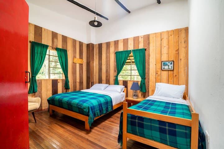 Room 1 for three people with a double bed and a single bed