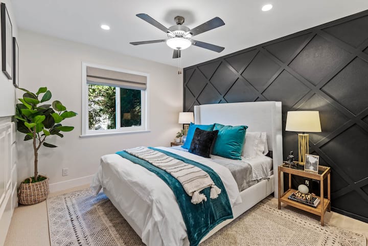 Guest Room 1 with queen bed and workstation