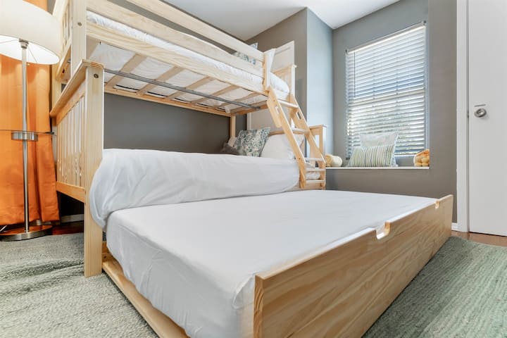 Convenience at its finest, a double bed on the bottom bunk with a twin sized bed on the top, then another double bed that's pullable from the bottom!