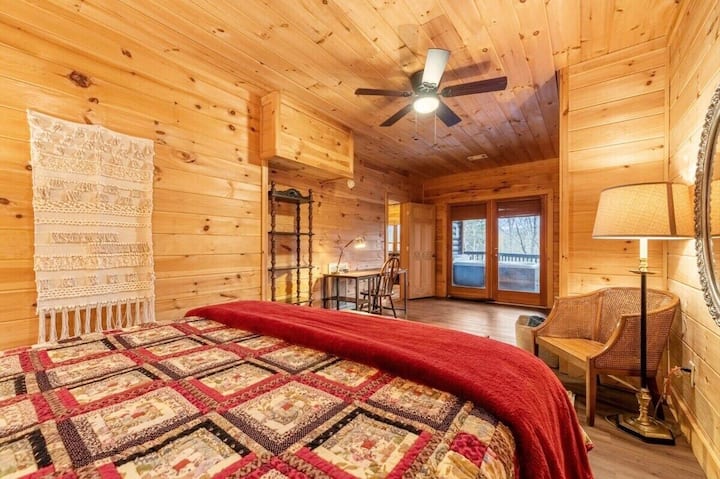 The bedroom offers a perfect blend of comfort and functionality, featuring a plush bed with soft linens that guarantee a restful night’s sleep.