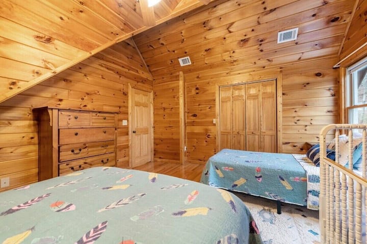 The beds are adorned with soft linens, creating an inviting atmosphere for relaxation.