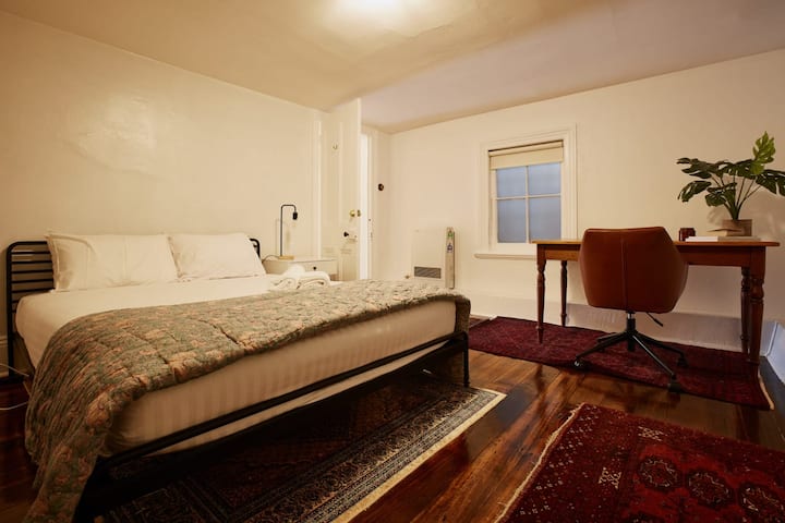 Downstairs features a third bedroom with a Queen bed, desk, and built-in wardrobe. 
All linen is of the highest quality and professionally laundered