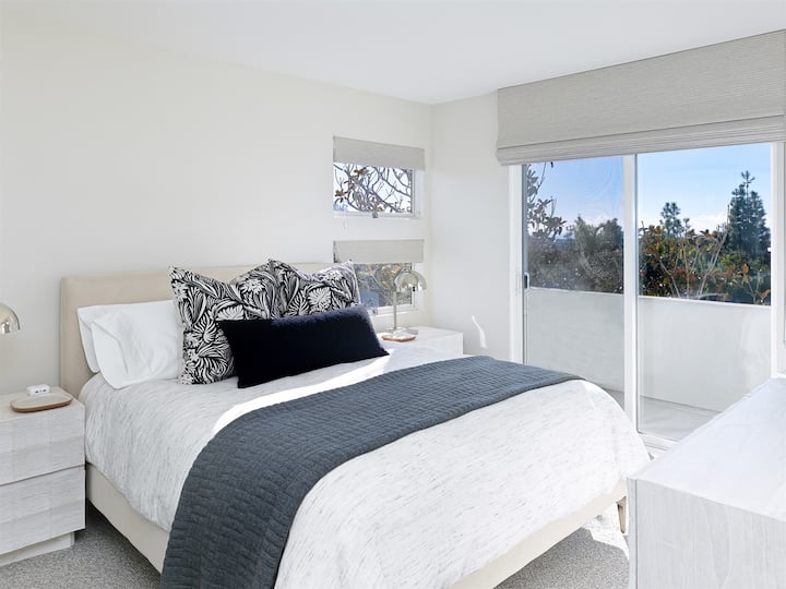 Second bedroom features private balcony and SmartTV