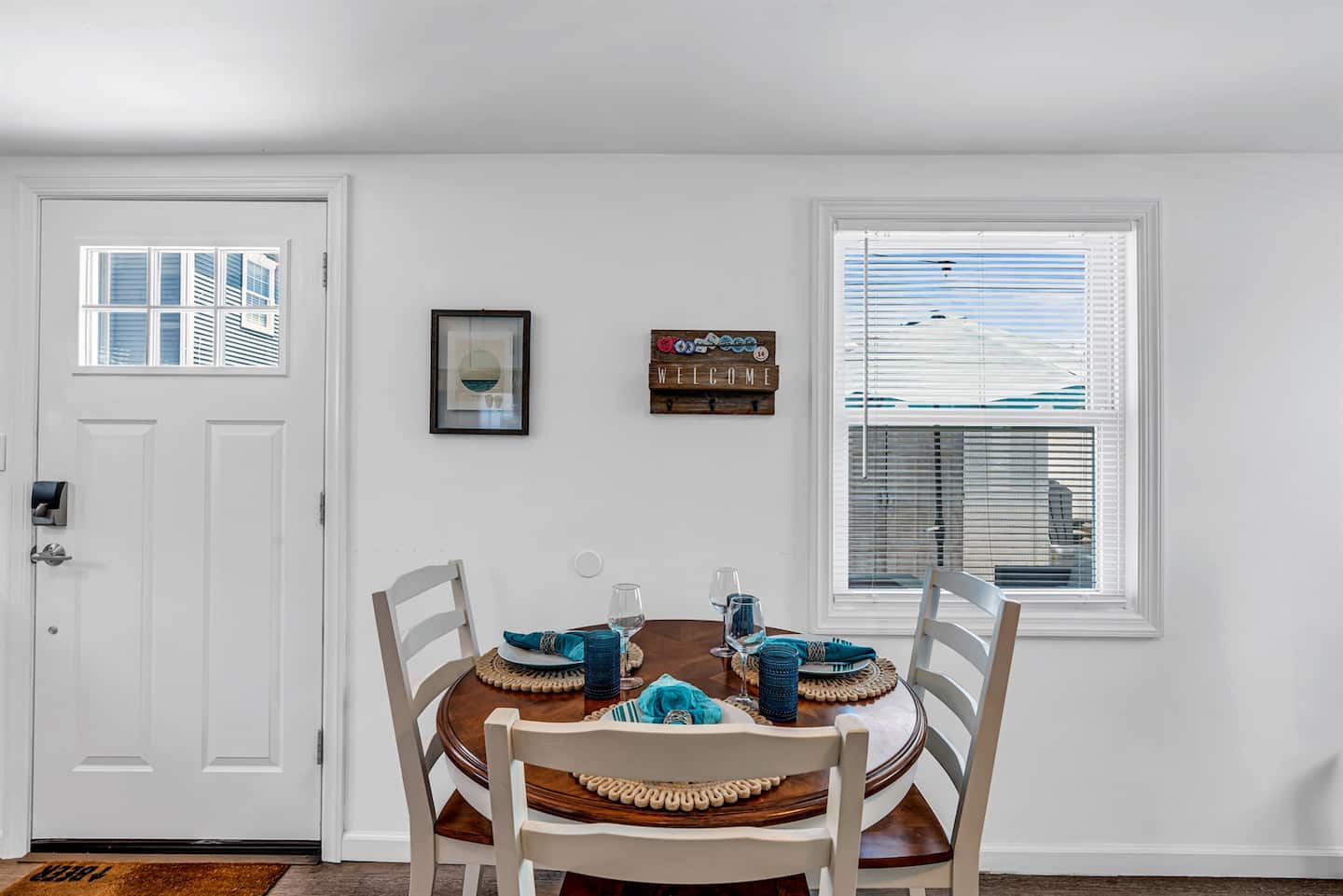 Dining area with coastal charm, perfect for meals, movies, and memory-making.