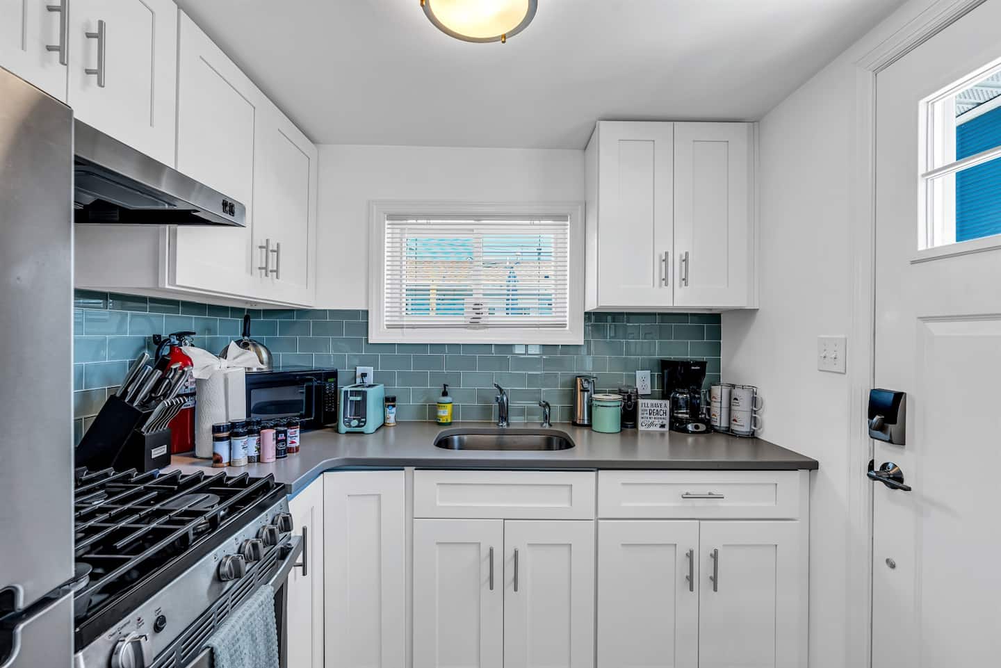 Pour a glass while you stir. This kitchen has the gas range, microwave, and stainless hood you'd expect from a place ten times the price.