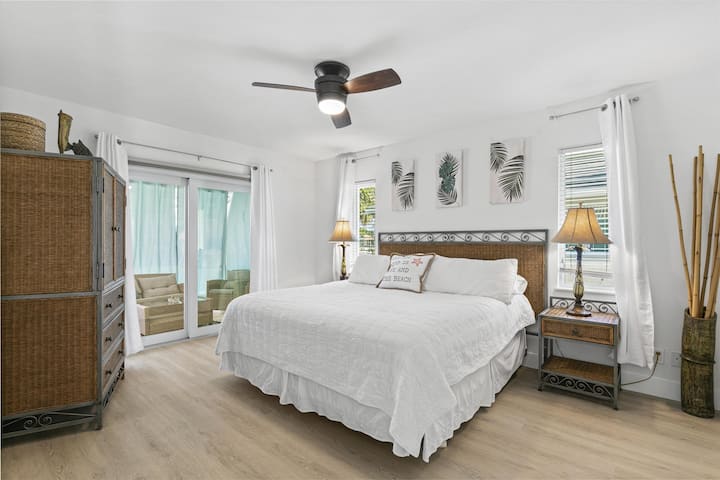 Enjoy Blissful Nights in a Master Bedroom Boasting a King Size Bed and Effortless Sliding Door Connectivity to Your Secluded Lanai and Pool Haven.