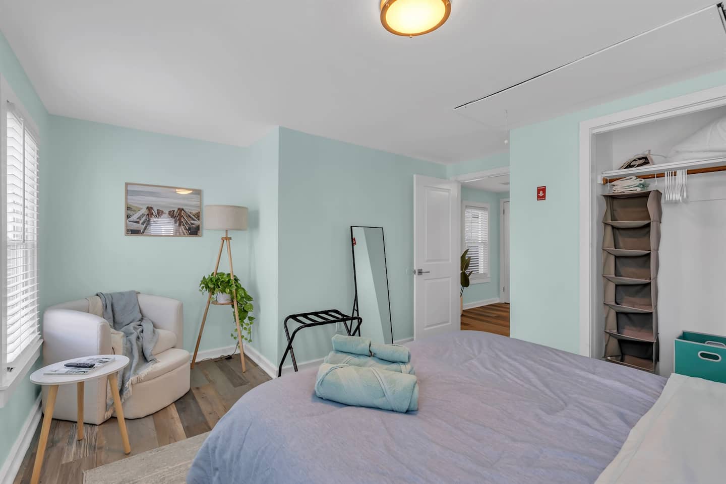 Unwind in this serene bedroom retreat, complete with a cozy reading nook, soft pastel tones.