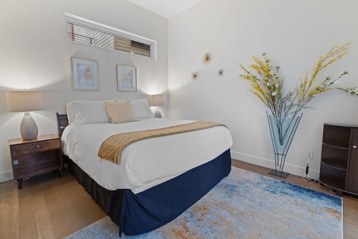 This comfortable bedroom has a closet and luggage rack for your convenience.