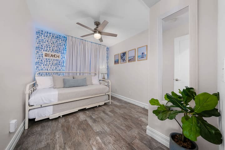 Twin bedroom w/ pull out trundle. This can convert to a king size bed. Also enclosed closet