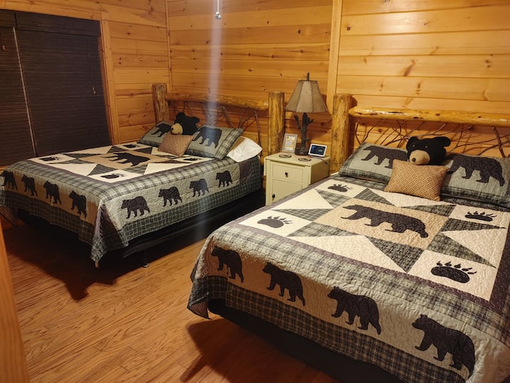 Basement bedroom with two queen beds, ideal for families or groups