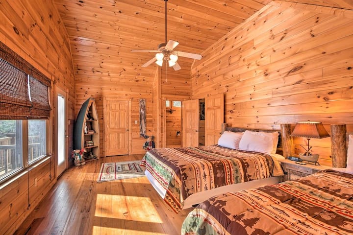 Alternate view of the upstairs bedroom showing spacious layout and seating