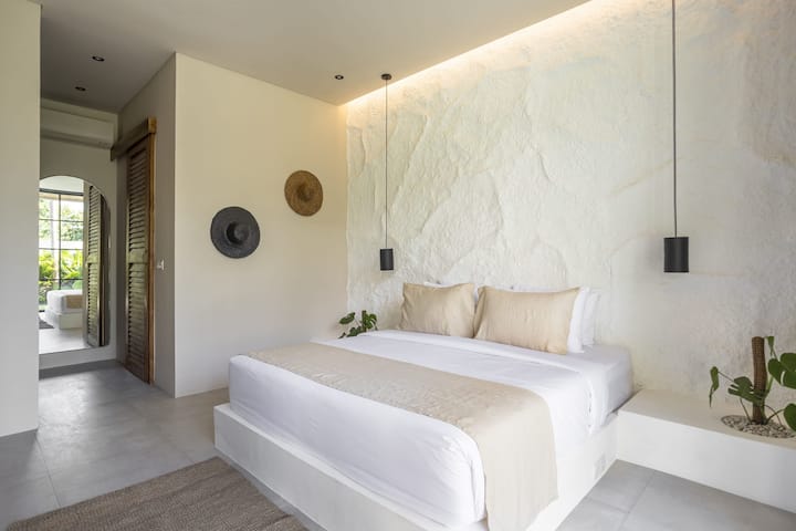 Bedroom #1 with a king-size bed, closet, and an ensuite bathroom
