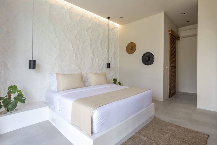 Bedroom #2 with a king-size bed, closet, and an ensuite bathroom