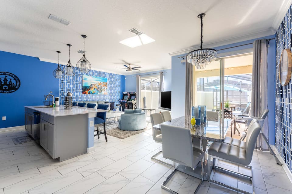Open living, dining, and kitchen area at Private Oasis